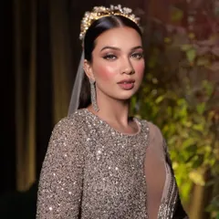 Serving full glam realness. This look is all about drama, with a flawless base, bold lashes, and a confident attitude.