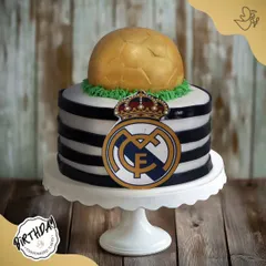 A champion's cake for Arjun's birthday in Dwarka. This Real Madrid cake, complete with the team crest and a golden football, is a fitting tribute for a true fan of the club.