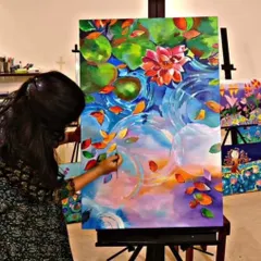 It is never too late to pick up a brush. Here, an adult student is completely absorbed in creating a large, vibrant canvas, showing that my classes are a perfect escape to explore your artistic side at any age.
