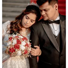 A tender moment between the bride and groom after saying "I do." This photo captures the love and emotion of a couple who have been together for a decade, finally sealing their bond.