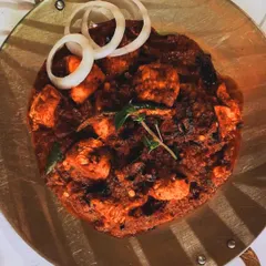 Straight from the hot griddle, our Chicken Tava is a semi-dry preparation packed with bold spices. Tender chicken pieces are seared to lock in the flavors, making it a perfect spicy starter.