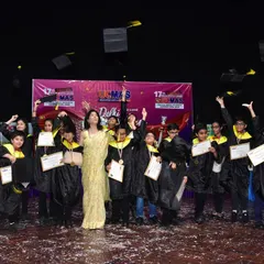 The joy of achievement. Our graduates celebrate at the 17th Delhi State Level Competition Awards Ceremony, tossing their caps in the air. This is a moment of pride for students, parents, and teachers.