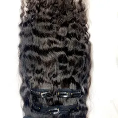 Our 4-piece premium curly clip-in hair extension set. These extensions add instant bouncy curls and volume, perfect for a glamorous look without any heat or damage.