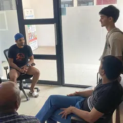 Parental involvement is crucial. Here, our coaches and staff engage in a discussion with an athlete and his family to align on his development goals.