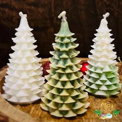 My Christmas tree pillar candles are a festive favorite. These detailed, tree-shaped candles are made from soy wax and come in classic green and white, adding a wonderful touch to your holiday decor.