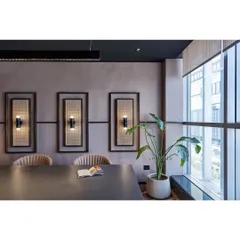 The right plant and planter can complete a room's aesthetic. In this modern office conference room, a tall Bird of Paradise plant in a simple, elegant FRC pot adds a touch of organic beauty without disrupting the clean design.