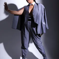 A full length shot showcasing the complete outfit for Sakshi Sindwani's magazine feature. The tied ankle detail on the trousers adds a unique and contemporary twist to the classic power suit.