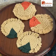 A set of four colorful table coasters, two with orange and two with green. They make a wonderful housewarming gift.