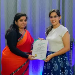 A student receives her graded music exam certificate. This is a testament to her hard work and the quality of my exam preparation courses.