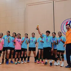 The team captain holds the championship trophy high after our victory in Shanghai. This is a moment of pure joy and the result of months of dedicated training.