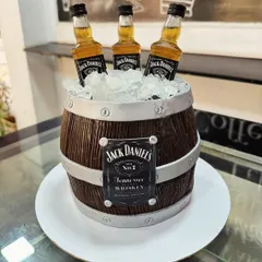 For the whiskey connoisseur, we crafted this realistic Jack Daniel's barrel cake. The wood grain texture and edible ice are all meticulously detailed to create a show-stopping centerpiece for an adult celebration.