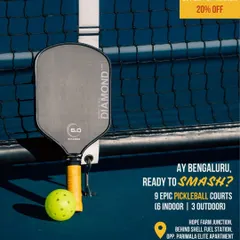 This shot focuses on the details that matter. A high-quality pickleball paddle and ball rest against the net on one of my pristine courts in Whitefield. It shows my commitment to providing top-notch facilities and equipment for the best possible playing experience.