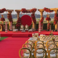 For the love of tradition, a 'Jashn e Ishq' theme brought to life. This design uses bold reds, majestic pillars, and a striking floral moon gate to create a regal and passionate setting for your wedding ceremony.