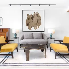 In this Magnolia residence living room, my Sex and the City Coffee Table takes center stage. Its bold, artistic presence anchors the entire seating arrangement, flanked by a sophisticated sofa and two vivid yellow armchairs from my collection. This is where furniture becomes the focal point of the story.