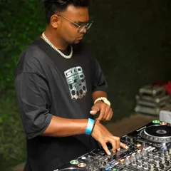 A clear shot of me working the controls during a set. I'm always locked in, reading the crowd and planning my next move.
