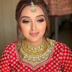 A close-up of the bride's makeup and hair. The soft, twisted hairstyle keeps the hair away from the face while maintaining a romantic feel, a technique I cover for bridal clients.