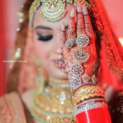 A close-up of our bridal nail work, perfectly complementing the intricate henna and stunning jewelry. Every detail matters on your big day, and we ensure your nails are flawless.