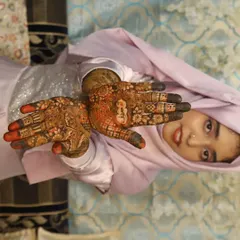 A joyful photo of the bride showcasing her henna on both hands. It was an honor to be a part of her special day.