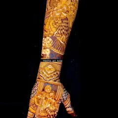 For the bride who is a true Krishna devotee. This design features a detailed portrait of Radha and Krishna on the arm, with a depiction of the 'grah pravesh' ceremony on the palm.