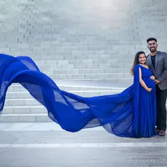 A classic couple's pose that feels both powerful and intimate, showcasing your partnership against a stunning backdrop.