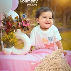 The most infectious giggle! This close up from an outdoor picnic photoshoot captures a moment of pure, unadulterated joy. The soft sunlight makes her smile even brighter.