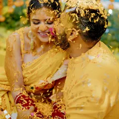 There's a special kind of magic in the chaos of a Haldi ceremony. This candid shot captures a moment of pure, uninhibited joy and affection between the couple, covered in turmeric and love at their destination wedding in Hua Hin, Thailand.