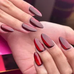 A close up of my deep cherry red jelly nails. This look is achieved by layering sheer gel polish to create a glossy, translucent effect that has incredible depth, perfect for a bold yet sophisticated statement.
