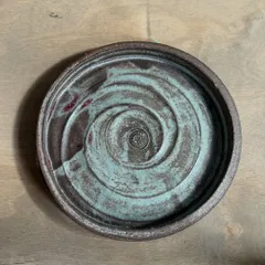 Another variation of our handmade side plate, this one showing a beautiful turquoise swirl. The interaction between our custom glazes and different clay bodies creates these happy accidents.