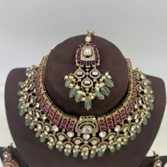 The maang tikka from the premium ruby and mint bridal set, designed to perfectly complement the main necklace.