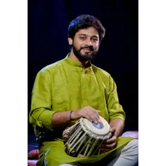 A professional portrait in a green kurta, captured during a photoshoot. This look is ideal for ethnic wear brands seeking a model with a classic and composed presence.