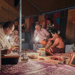 The bustling atmosphere of the Yakshagana 'Chowki' where artists prepare for the night's performance. I aim to document the entire process, showing the community and shared energy that exists behind the stage.