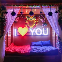 Another one of my romantic setups, this cozy space features floor seating, floral decor, and an "I Love You" sign, designed for couples to relax and connect.