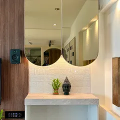 This is a corner of our experience center, designed to show how automation and interior design can work together. The smart panel on the wall controls the speakers and the accent lighting above the console.