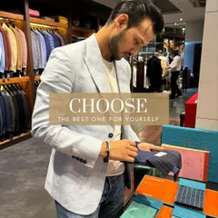 Here, my son and partner Kabir is seen in our powder blue linen blazer while examining new fabric swatches for the summer collection. The process of curating materials is constant and deliberate.