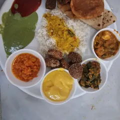 Another example of our festive plate, served at a wedding in Airoli. This one features aamras, green chutney, and other traditional dishes that make a meal special.