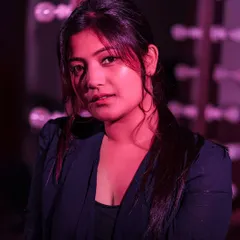 An experimental portrait using a simple flash with a magenta gel. By bouncing the light off a wall, we created this beautiful color gradient and moody atmosphere.