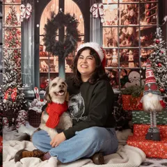 All smiles for this Christmas shoot! This woman and her happy dog, complete with a festive red scarf, look so joyful surrounded by our winter wonderland backdrop.