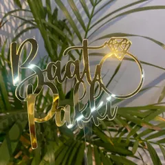 For the fun-loving couple! This "Baat Pakki" topper with a diamond ring detail is a fantastic way to announce your engagement or celebrate your roka ceremony.