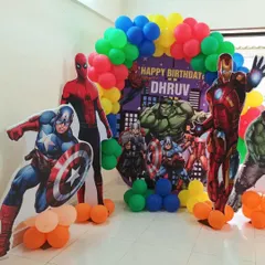 We assembled the ultimate Avengers party for a young superhero fan. This setup features life-sized cutouts of Iron Man, Captain America, and Spider-Man against a vibrant balloon arch and a custom city backdrop.