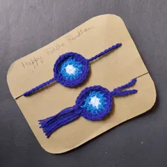 This is my evil eye Bhai-Bhabhi rakhi set. It includes a rakhi for your brother and a matching lumba for your bhabhi, both featuring the protective evil eye design.
