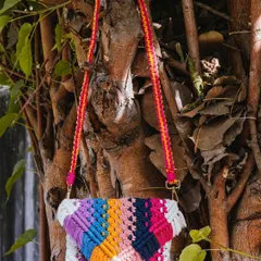 Let's add a pop of color to your day! 🌸 This vibrant, multi-color macrame sling bag is such a joy to make and wear. I wove together shades of purple, blue, orange, and pink to create this unique piece. It comes with a colorful strap and is perfect for adding a fun, bohemian touch to any outfit.