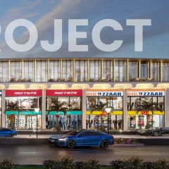 A curved glass volume crowns this portion of the mall's structure, breaking the linear flow with a bold architectural gesture. The design creates a landmark that is both functional and visually exciting.