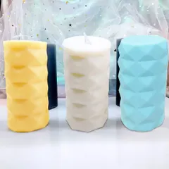 A selection of my diamond-cut pillar candles in yellow, white, and blue. You can mix and match colors to suit your personal style or event theme.