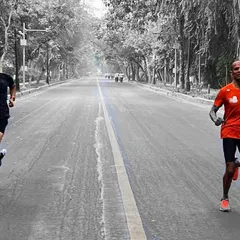 A habit must be established before it can be improved. Here, two of our athletes put in the work during an early morning road session, building their endurance base.