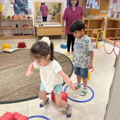 An obstacle course is an invitation to problem-solve with the body. Here, children develop gross motor skills, balance, and coordination while navigating challenges in a fun, supportive group setting.