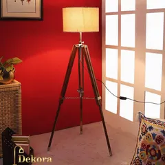 Our classic wooden tripod floor lamp adds a touch of mid-century modern elegance to your home. The sturdy wood construction, complemented by metal accents, provides warm, ambient lighting perfect for a reading nook or office space.