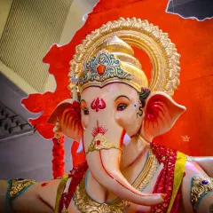 A close-up view of the divine face of a Ganpati murti I sculpted. The intricate details on the trunk, the expressive eyes, and the golden mukut are all handcrafted to create a powerful and serene presence.