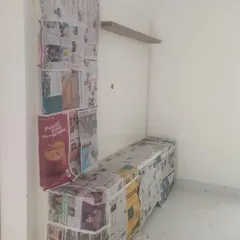 Protecting your belongings is our priority. Here, we see a media unit fully masked, ready for the wall transformation to begin.