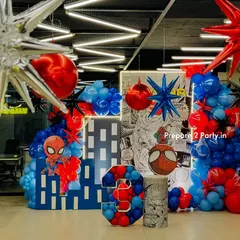 I bring superhero action to life with immersive setups like this Spiderman theme. The decor features a dynamic comic book style backdrop, city building cutouts, and a balloon mosaic number, creating a complete world for the birthday boy.