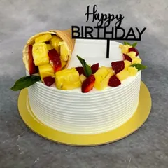 A variation of the gravity-defying cone cake, this time with fresh pineapple and strawberries for a tropical twist.